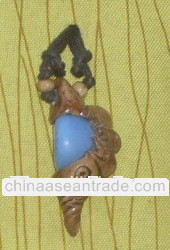 Wood carved necklace with Aqua Blue Gem