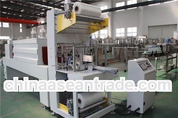 Automatic high efficiency shrink wrap machine