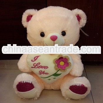 Best selling plush bear toy with a heart for lovers