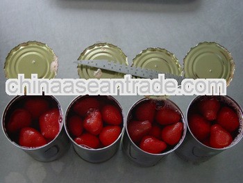 Fresh organic canned strawberry in syrup in tins