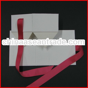 White gift folding box, flat pack gift box with hot pink ribbon