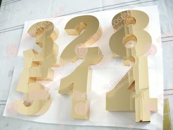 advertisement polished golden number sign