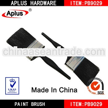 black bristle paint brush yellow plastic wooden handle brush