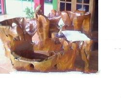 tables and chairs carved from teak wood