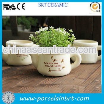 orange glazed ceramic flower pot