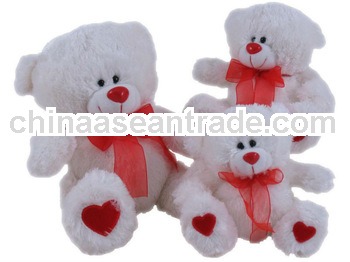 white plush toy teddy bear with tie